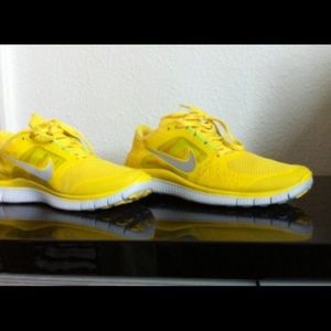 Yellow Nike Free Runs Size: US10.
